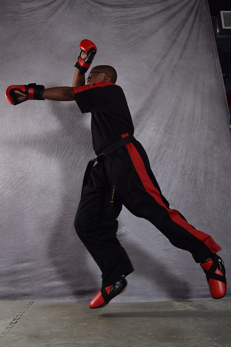 High-energy sport karate blitz captured in action, illustrating the speed, agility, and precision of the martial artist in a dynamic point fighting performance